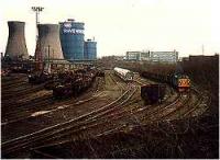 View looking east over a marshalling yard in the Ravenscraig Steelworks. Class 37 delivering a train of scrap.<br><br>[Ewan Crawford //]
