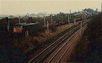 Northbound empty steel coil wagons for Ravenscraig running north to Mossend via Holytown passing Law Junction.<br><br>[Ewan Crawford //]