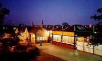 View looking south at Milngavie station at night.<br><br>[Ewan Crawford //]
