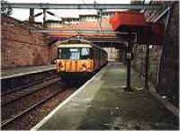 Looking east at Greenock West station. Class 303 in station.<br><br>[Ewan Crawford //]