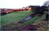 View looking south over the site of the former Helmsdale engine shed towards Helmsdale station.<br><br>[Ewan Crawford //]