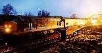 Class 37 hauled sleeper train heading south at Rannoch station.<br><br>[Ewan Crawford //]