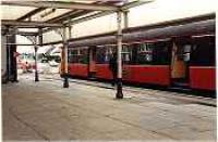 Looking at a class 303 from under Balloch Centrals canopy.<br><br>[Ewan Crawford //]