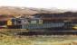 Class 37 hauled ballast train running east into Achnasheen station crossing a viaduct by the station. View looks south.<br><br>[Ewan Crawford //]