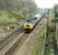 Class 47 hauling a passenger train north past Plean Junction. Access by kind permission of British Rail.<br><br>[Ewan Crawford //1988]