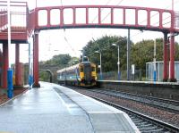 A Glasgow bound train arrives at Curriehill station in October 2002.<br><br>[John Furnevel 27/10/2002]