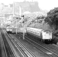 A Type 2 powered push-pull service overtakes a DMU at Saughton in May 1975, with Edinburgh Castle dominating the background.<br><br>[John Furnevel 30/05/1975]