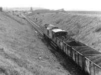 Pushing coal uphill. A loaded coal train leaving Littlemill Colliery, Ayrshire, in 1973, the year before closure.<br><br>[John Furnevel //1973]