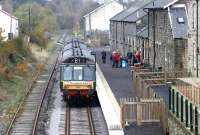 A DMU calls at Leyburn on the Wensleydale Railway in October 2004. View is east towards Leeming.<br><br>[John Furnevel 31/10/2004]