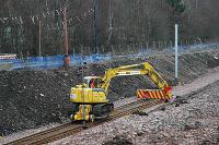 Rail mounted crane reaches the present end of the Larkhall branch. It is delivering sleepers to just north of Merryton station.<br><br>[Ewan Crawford 20/03/2005]