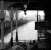 A pair of type 2 diesels taking a coal train north through Ayr station during a thunderstorm in the spring of 1972, under the watchful eye of Sherlock Holmes standing in the shadows.<br><br>[John Furnevel 02/03/1972]