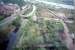 Old Kilpatrick station viewed from the Erskine Bridge. The old station is now partly landscaped. The partly closed oil depot is seen top right. Forth and Clyde Canal on left.<br><br>[Ewan Crawford //]