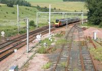 An up Voyager runs past the south end of the loops at Grantshouse in July 2006 approaching the PW sidings on the site of the old station.<br><br>[John Furnevel 04/07/2006]