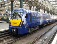 Standing at platform 10 of Glasgow Central station is ScotRail class 334 no 334006. Photographed on 16 October 2010, the unit is the first of its class to appear in Saltire livery. [See image 21672 for comparison]<br><br>[Darrel Hendrie 16/11/2010]