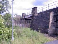 Looking east towards Paisley, this shows the fly-under as it is now. The bridge is still in place, but the this part of the track bed is now the site of a re-cycling plant and haulage yard.<br><br>[Graham Morgan 26/06/2006]