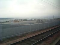 Taken from a Glasgow train, this shows the former Elderslie goods yard. WH Malcolm now owns the site as its freight terminal, and is currently expanding and improving the site.<br><br>[Graham Morgan 05/08/2006]