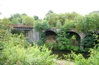 Looking south over the River Kelvin in August 2006 at the massive retaining walls and viaduct that once brought the Lanarkshire and Dumbartonshire Railway across the river on the approach to Maryhill Central station.<br><br>[John Furnevel 02/08/2006]