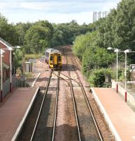 Maryhill station in August 2006 with a train for Glasgow Queen Street coming off the line from Anniesland at Maryhill Park Junction.  <br><br>[John Furnevel 14/08/2006]