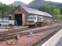 Truck come OnTrack Machine in sidings at Crianlarich.<br><br>[Colin Harkins 06/05/2005]