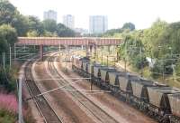 Coal empties westbound through Rutherglen on 15 August 2006 on their way back to Hunterston. (Taken through the cleanest window of the station's pedestrian walkway). <br><br>[John Furnevel 15/08/2006]