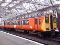 Class 314 314202 at Glasgow Central waiting to depart with the service to Neilston. This is the last train still painted in SPT orange and black, and it will lose this as part of the Class 314 modernisation programme.<br><br>[Graham Morgan 26/08/2006]