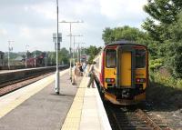 Bay platform 3 at Barrhead in August 2006, with a train boarding for Glasgow Central.<br><br>[John Furnevel 17/08/2006]