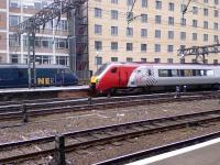 GNER DVT being passed by departing Virgin Class 221 Voyager at Glasgow Central<br><br>[Graham Morgan 26/08/2006]