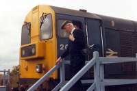 The driver of a pair of 20s surrenders the token from Annbank on arrival at Mauchline.<br><br>[Ewan Crawford //1988]