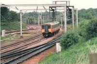 When this picture was taken only 2 EMU turns reached Carstairs each day. This 318 arriving ECS to form a connection to Glasgow Central from a Bristol/Edinbugh train.<br><br>[Brian Forbes /09/1998]