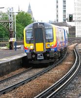 Train from Waterloo passing through Vauxhall in July 2005 en route to Portsmouth Harbour.<br><br>[John Furnevel /07/2005]