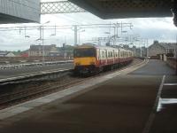 318257, at the rear of a two unit class 318 train, departing Paisley Gilmour Street for Glasgow<br><br>[Graham Morgan 12/09/2006]
