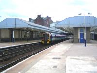 Platform view at Arbroath looking south in August 2006. The through platform on the right is disused as is the old goods yard and shed beyond. <br><br>[John Furnevel 09/08/2006]