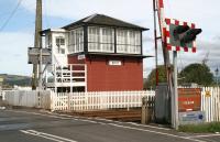 Looking west over the level crossing at Errol on 4 September 2006. A right turn after the signal box leads into the old yard and the former station itself. The old station building is currently operating as a craft shop and tea room. <br><br>[John Furnevel 04/09/2006]