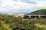 <h4><a href='/locations/J/Jamestown_Viaduct_Inverkeithing'>Jamestown Viaduct [Inverkeithing]</a></h4><p><small><a href='/companies/F/Forth_Bridge_Railway'>Forth Bridge Railway</a></small></p><p>Looking west along the Forth in June 2006 as the Zeebrugge Ferry docks at Rosyth and a Waverley bound train heads for the Forth Bridge. 14/14</p><p>20/06/2006<br><small><a href='/contributors/John_Furnevel'>John Furnevel</a></small></p>