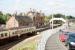 A Glasgow bound train pulls into Uddingston station on a sunny morning in August 2006. A striking station building which even boasts a coffee shop!    <br><br>[John Furnevel 11/08/2006]