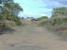 To the left the station once stood... The bridge ahead looking toward Forfar infilled to allow the Farmer wider machinary to cross. Little sign of the station to the left although on closer inspection you can see the brickwork<br><br>[Colin Harkins 31/08/2006]