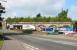 Looking south along the A736 at Barrhead in the summer of 2006. In the background is the remaining section of the viaduct that once carried the Paisley and Barrhead District Railway. [See image 7557]<br><br>[John Furnevel 17/08/2006]