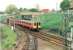 Eastbound train at Sunnyside Jct. The line in the foreground goes to Whifflet S.Jct. and the line under the bridge, to Gunnie yard & Gartsherrie. <br><br>[Brian Forbes //1999]