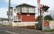 Looking west over the level crossing at Errol on 4 September 2006. A right turn after the signal box leads into the old yard and the former station itself. The old station building is currently operating as a craft shop and tea room. <br><br>[John Furnevel 04/09/2006]