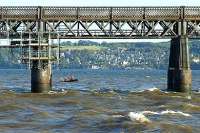 Renovation work in progress on the Tay Bridge - scaffolding and safety boat in evidence.<br><br>[Adrian Coward 19/09/2006]