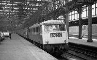 83003 prepares to take its train out of Glasgow Central on 26 March 1974.<br><br>[John McIntyre 26/03/1974]
