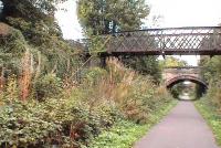 Eskbank & Dalkeith, now overgrown. Steps up to old footbridge from platform visible. This station closed with the entire Waverley line in 01.1969<br><br>[Brian Forbes 02/10/2006]
