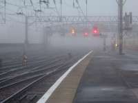 A foggy Glasgow Central. Looking towards the Clyde Viaduct with the signals standing out through the fog<br><br>[Graham Morgan 30/09/2006]