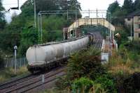 Mossend - Fort William Junction freight heads west through Bowling.<br><br>[Ewan Crawford 06/10/2006]