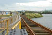 This bridge links the dock network to the Workington Steelworks network. The main Cumbrian Coast Railway is in the background right.<br><br>[Ewan Crawford 27/09/2006]