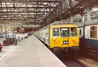 Strikebound platforms. The 311 set sits alongside a Mark 1 Sleeper train including a Restaurant Car. Mopeds were quite common 30 odd years ago.<br><br>[Brian Forbes //1974]