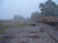 What is left of the goods yard at Ardgay. Overgrown platforms and rusty sidings. 16/10/06<br><br>[John Gray 16/10/2006]