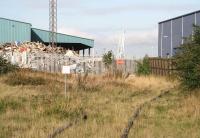 Leith South goods depot stands behind locked gates on the abandoned link from Leith South yard in September 2006. The VA Tech building on the right is located within the dock estate, with the cranes between the two standing alongside the Edinburgh Dock.<br><br>[John Furnevel 12/09/2006]