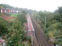 Whinhill station, looking west towards Drumfrocher and Branchton. This station is typical of the stations that have either been newly opened or re-opened by SPTA and its successor, the SPT.<br><br>[Graham Morgan 25/10/2006]