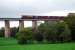 An EWS class 66 locomotive with a loaded coal train from Killoch washery ventures out onto Enterkine Viaduct in October 2006.<br><br>[Ewan Crawford 06/10/2006]